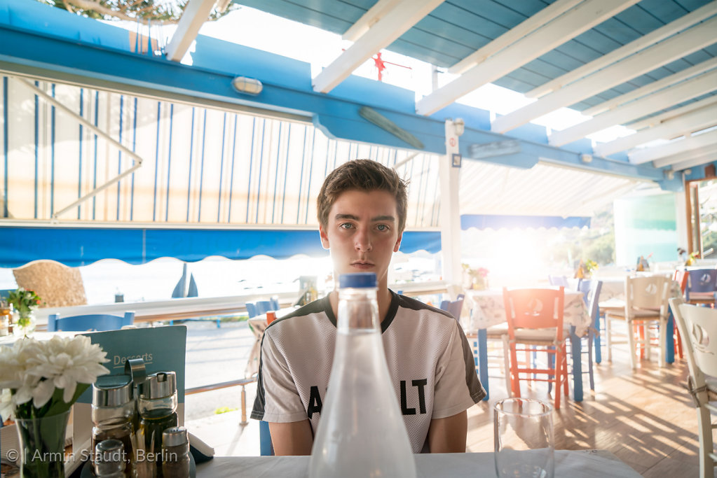 young man in a greek restaurant