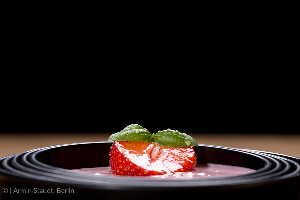 quark with strawberry in a black asian bowl