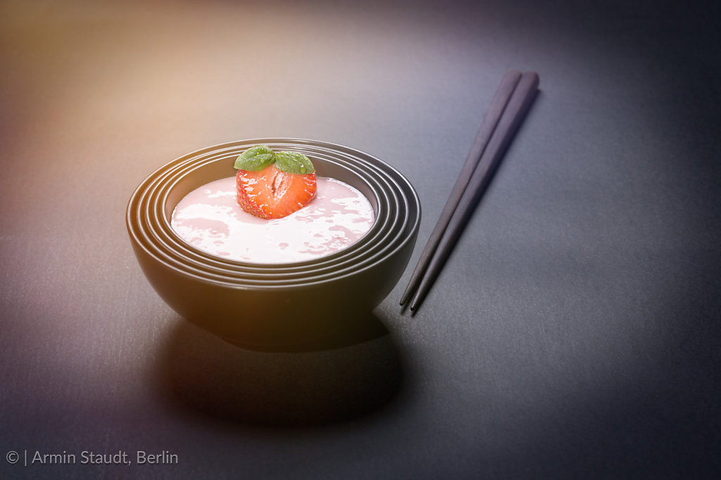 quark with strawberry in a black asian bowl