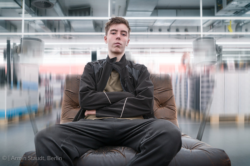 surround sound, young man on a leather armchair
