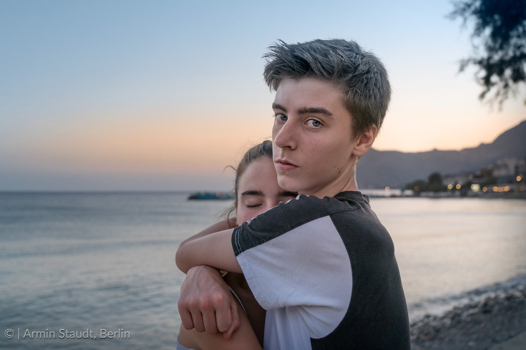 Young couple in the evening at the sea