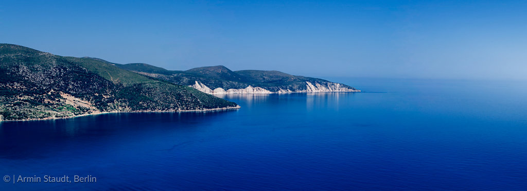 mediterranean panorama landscape, promontory in the deep blue sea