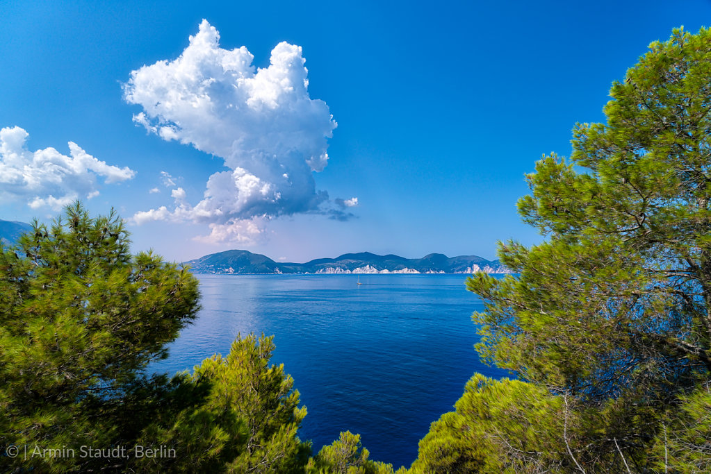 mediterranean landscape with ocean and dramatic clouds