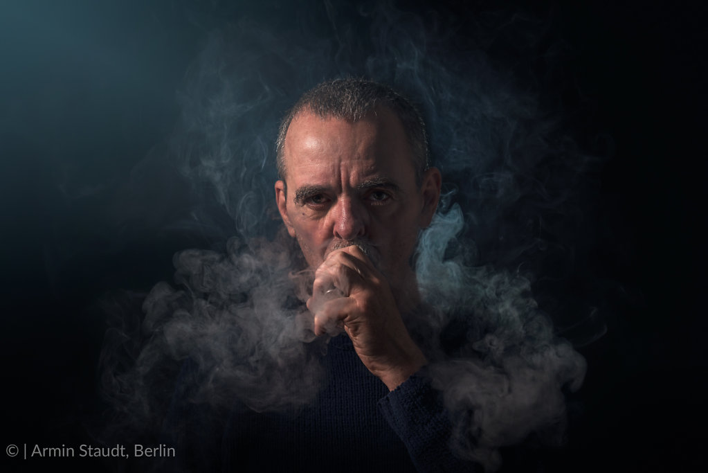 portrait of a man with vaporizer and smoke