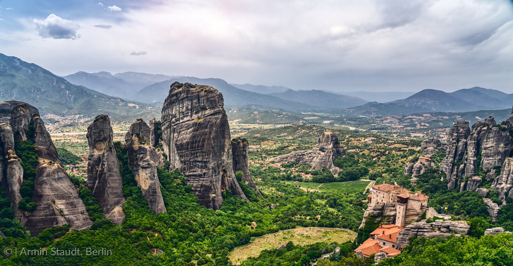 Rock formation and monastery in the mountain landscape of Meteora, Greece