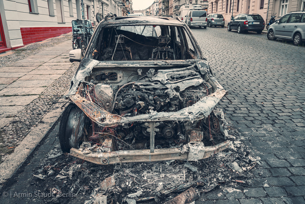 burnt out car in the streets of berlin